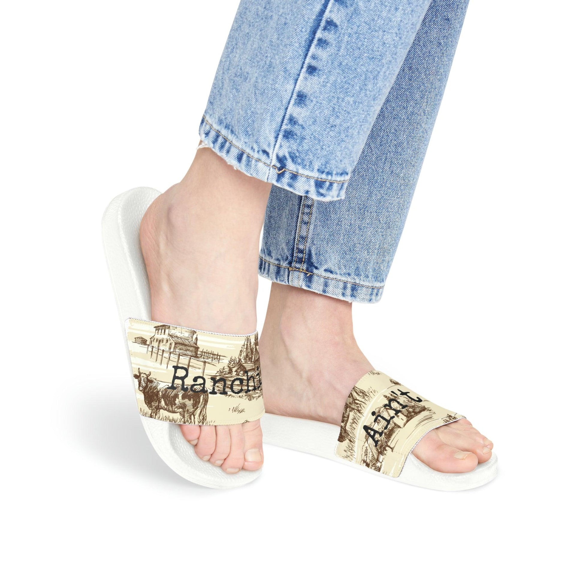 Ranchin’ Ain’t Easy Women's PU Slide SandalsTake on the summer heat with style thanks to these personalized slide sandals for women. Made with PU outsoles and an edge-to-edge strap customization that will nevePU Slide SandalsThe Hufeisen-Ranch (WYO Wagyu)Shoes